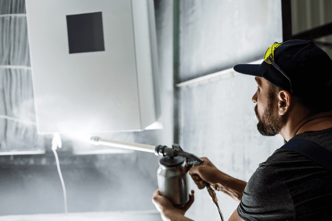 Technician cleaning a home appliance